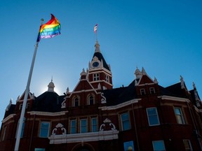 A rainbow flag flies outside Stratford city hall. Homophobic vandalism found in the city’s downtown core last week has sparked a response from the community, where – like many others in Ontario – hate-motivated crimes have been on the rise. (Chris Montanini/Stratford Beacon Herald)