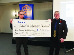 Nisku Leduc Rotary Club President Jon Bissell and club member Harold Wilson are shown holding a cheque for $3280.00, raised last spring at the Chamber Expo 50/50 draw through the efforts of the Rotary Club. (Gord Lewis)