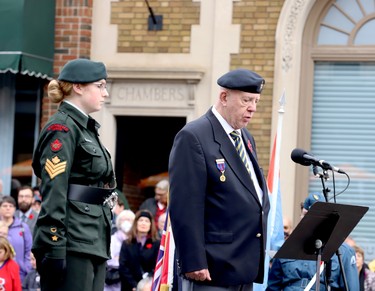 Paul Hodgert and Army Cadet Kailey Roosenmaallen take turns reading In Flanders Fields. (RONALD ZAJAC/The Recorder and Times(