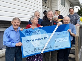 The result of asking everyone to make a silly face. Several members of the L’Arche Sudbury family, including Bishop Thomas Dowd, assemble for a photo on Friday to celebrate a $100,000 donation from the Bishop Alexander Carter Foundation. The money will be used to help build a 28-unit inclusive-living apartment complex on Bancroft Drive.