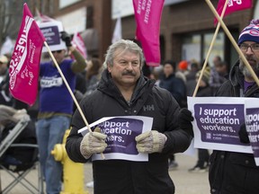 Canadian Union of Public Employees held a demonstration Saturday outside Nipissing MPP Vic Fedeli's constituency office. The union is closely watching to ensure the province repeals Bill 28 Monday as promised.
