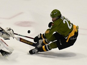 Goaltender Ben West of the Barrie Colts darts from his crease to counter Nic Sima of the visiting North Bay Battalion in Ontario Hockey League action Saturday night. The Troops play host to the Kitchener Rangers at 2 p.m. Sunday.