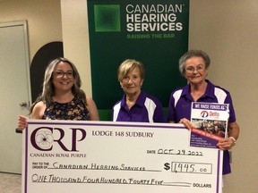 Yolande Chevrette and Darlene Sargent, members of Sudbury Royal Purple Lodge 148, present a cheque for $1,445 to Anna Bertulli at the Canadian Hearing Services to assist two clients in obtaining hearing aids. The lodge has been donating to local groups with the help of Delta Bingo.
