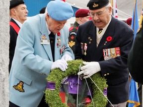 The Royal Canadian Legion Branch 517 wreath was laid by veterans Curly Andrews (left) and Jim McKenzie at the Remembrance Day ceremony at the Petawawa cenotaph on Nov. 11. Tina Peplinskie