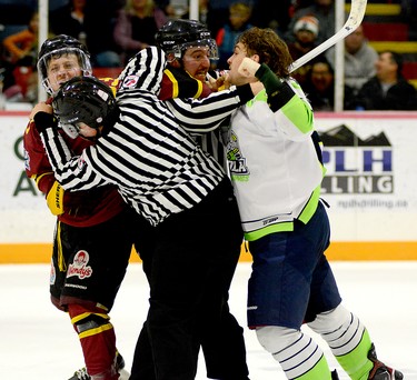 Timmins Rock forward Nolan Ring and Espanola Paper Kings blue-liner Liam McDonald tangled during the second period of Friday night’s NOJHL contest at the McIntyre Arena. Linesmen Justin Rodgers and Tyler Hofferd had a difficult time separating the duo, but cooler heads eventually prevailed and the Rock went on to dump the Paper Kings 7-1. THOMAS PERRY/THE DAILY PRESS