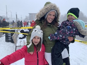 The Vandromme family, Celeste, 7, Elias, 4, and mom Stephanie traveled from Oakville on Friday night to enjoy the Port Dover's Christmas Fest and Santa Claus parade.  They were among the many people to greet Santa and Mrs.  Claus at the pier on Nov. 19. Vincent Ball