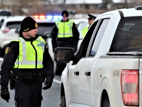 Middlesex OPP set up a RIDE checkpoint on the Highway 402 off-ramp at to Colonel Talbot Drive on Nov. 17 to kick off the annual holiday campaign against impaired driving. Dale Carruthers/Postmedia