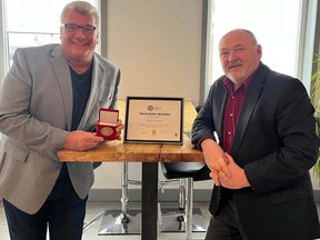 Robert Peace (left) accepts his Sault Ste. Marie YMCA’s 2022 Peace Medallion from Robert Burns, Sault YMCA CEO. Supplied photo