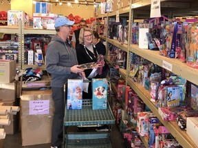 Volunteers at the Strathcona Christmas Bureau shop the aisles of gifts to create hampers for local families in need. Until Wednesday, Nov. 30 at 5 p.m., those needing help must reach out to the non-profit by calling 780-918-2521, Monday to Thursday from 8:30 a.m. to 4 p.m. Photo supplied