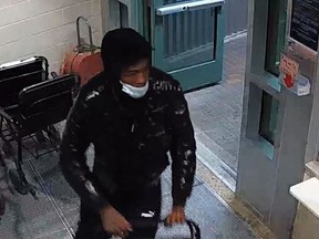 Police are seeking public help in identifying the individual, pictured here in security footage, who delivered the victim of a shooting to Health Sciences North.