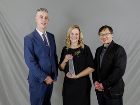 Town Manager Tom Goulden (left) and Mayor William Choy (right) present community peace officer (CPO) Jennifer Penner (centre) with the 2022 Matthew Claus Award during the Town of Stony Plain's annual Long Service Awards and Recognition Banquet on Friday, Nov. 18. Photo courtesy of the Town of Stony Plain.