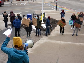 At a student climate strike in front of Stratford city hall Friday evening, Sammie Orr, a member of Stratford District Secondary School's Eco Club, speaks about the need for area residents and local governments to focus on adapting to the effects of climate change as floods, fires, hurricanes and other natural disasters driven by global warming continue to increase in frequency and intensity.  (Galen Simmons/The Beacon Herald)
