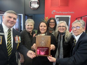 Pierre Breckenridge, Branch 25 poppy chair and Helen Stewart, Branch 25 president Branch 25 (far right) present The Real Estate Stop’s Cathy Gregorchuk, Chantal Laliberte, Mandy Thorkilson and Donna Gioia, with 2022 Best Storefront Display honours. Supplied