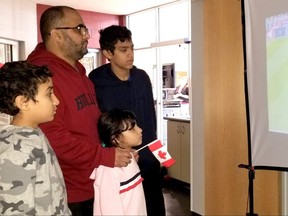 Souhail, Said, Mariam, and Mehdi Agouzoul watch one of the screens showing the Canada-Croatia World Cup soccer match at the viewing party benefiting the Agapè Centre at the Benson Centre on Sunday November 27, 2022 in Cornwall, Ont. Greg Peerenboom/Special to the Cornwall Standard-Freeholder/Postmedia Network