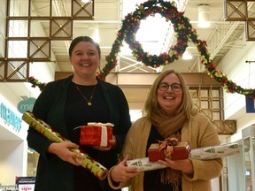 Volunteers with St. John Ambulance will be back in front of the Winners at Stratford Mall, formerly the Festival Marketplace Shopping Centre, wrapping gifts in exchange for voluntary donations from Dec. 7-24. Pictured, are Stratford Mall property manager Allison Ballantyne and St. John Ambulance Stratford branch manager Karen Mahovlich. Galen Simmons/The Beacon Herald/Postmedia Network