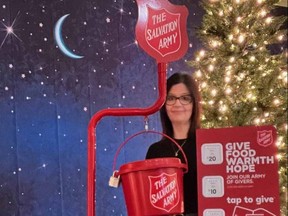 Owen Sound Salvation Army Family Services Coordinator Alice Wannan with one of their kettles equipped with the TipTap system that allows for debit, credit and cellphone pay options.