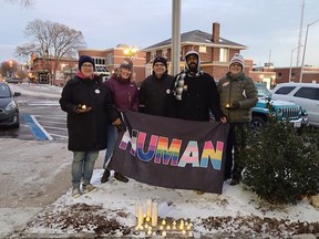 CK Gay Pride Association board members Amy Vickery, Nancy Kay, Dave Butler, Nathan Dawthorne and Daphne Houston hold a flag outside the Chatham-Kent Civic Centre in recognition of Transgender Day of Remembrance on Nov. 20. (Handout/Postmedia Network)