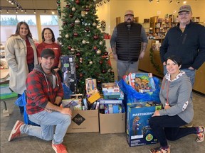 Pembina Pipeline workers dropped off a bunch of toy donations at the Strathcona Christmas Bureau's depot headquarters on Nov. 25. They also stayed to assemble hampers. Photo via Twitter/@Str_XmasBureau