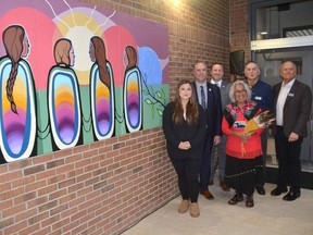 A artwork called Across the Horizon by Saugeen First Nation artist and visual storyteller Emily Kewageshig was unveiled in the front entrance of the Owen Sound campus of Georgian College on Wednesday, November 30, 2022. from left, are Kewageshig; Georgian College President and CEO Kevin Weaver; Dave Shorey, executive director of the Owen Sound campus; Saugeen First Nation elder Shirley John; Georgian Manager of Indigenous Services and Access Programs Greg McGregor, and Steven Lowe, vice-chair of the Georgian College Board of Governors.