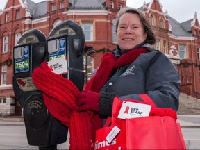 Stratford knitter Laurie Krempien-Hall and a group of local volunteers will decorate the city’s core with red scarves on Thursday, also World AIDS Day. The handmade scarves, part of an awareness campaign, are free to take. (Chris Montanini/Stratford Beacon Herald)
