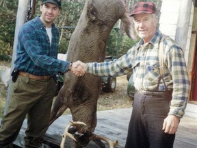 The author and his father Rathwell with the trophy buck known as ‘Ol Toothless’ taken at their family camp in 1996.