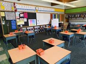 An empty classroom is shown in Scarborough, Ont., on Monday, September 14, 2020. Canada's largest school board says it will close schools Friday in response to a planned mass walkout from education workers protesting Ontario's back-to-work legislation.THE CANADIAN PRESS/Nathan Denette