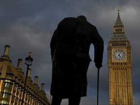 The statue of Winston Churchill is seen in Parliament Square with the Houses of Parliament and the Elizabeth Tower, more commonly known as Big Ben, in the background, in London, Britain, October 20, 2022. 
REUTERS/Toby Melville