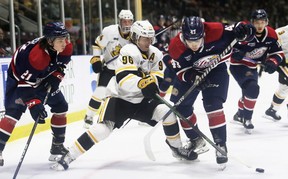Ty Voit (96) of Sarnia Sting takes on Davis Codd (43) of Saginaw Spirit in the first period at the Progressive Auto Sales Arena in Sarnia, Ont., Friday, November 11, 2022. Mark Malone/Chatham Daily News/Postmedia Network