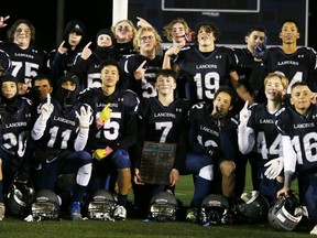 The Ursuline Lancers celebrate their 47-7 win over the St. Patrick's Fighting Irish in the LKSSAA junior football final at Norm Perry Park in Sarnia, Ont., on Saturday, Nov. 12, 2022. Mark Malone/Chatham Daily News/Postmedia Network