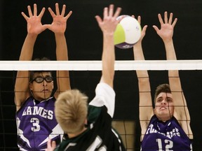 Jerry Zomerman (3) and JT Scott (12) of Chatham Christian try to block Aidan Taylor (5) of Lajeunesse during the SWOSSAA senior boys' volleyball A final at Chatham Christian High School in Chatham, Ont., on Tuesday, Nov. 15, 2022. Mark Malone/Chatham Daily News/Postmedia Network