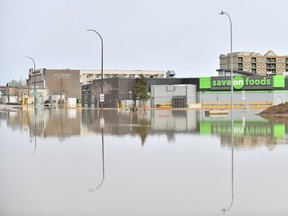 The Save On Foods off Franklin Avenye is surrounded by flood waters in downtown Fort McMurray, Alta. on Monday, April 27, 2020. THE CANADIAN PRESS/Greg Halinda