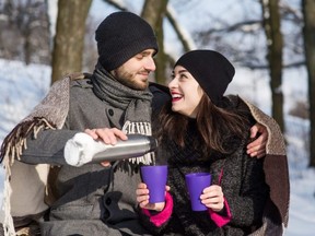 Romantic couple hot drink from thermos