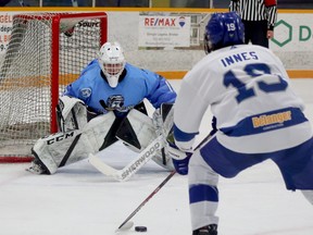Cochrane Crunch goalie Jake Dubinsky prepares to make a save on Greater Sudbury Cubs defenceman Chris Innes during NOJHL action at Gerry McCrory Countryside Sports Complex in Sudbury, Ontario on Thursday, November 24, 2022.