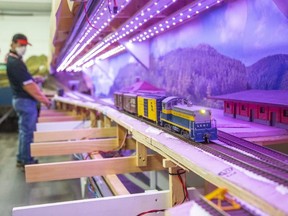 Alex Cabita operates the Lake Erie and International Railroad replica during the London Model Railroad Group's open house in London on Tuesday November 8, 2022. (Derek Ruttan/The London Free Press)