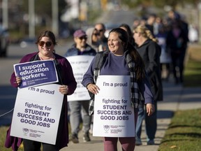 CUPE members picket along Commissioners Road west of Wharncliffe Road in London on Nov. 7, 2022. Hundreds of school support workers were out in various locations across the city. (Mike Hensen/The London Free Press)