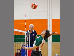 Chris Barkley of the North Park Collegiate Trojans goes up to spike the ball during a senior boys volleyball match against the Pauline Johnson Collegiate Thunderbirds on Thursday. Brian Thompson/Brantford Expositor/Postmedia Network