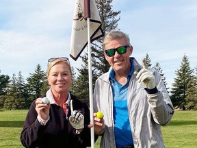 What are the odds? Both Effie Nesbitt (left) and husband Ken, of Mitchell, recorded holes-in-one during the same round of golf on Oct. 30 at the Mitchell Golf & Country Club. Effie did it on the first hole she played (#10), while Ken did it on the last one (#3) they played for the day, calling it quits while the getting was good! Congratulations!