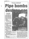 A Toronto Sun newspaper clipping from July 2000 with Toronto Police bomb squad Sgt. Christopher May examining the destruction. (exhibit from R v. Michael Wentworth)