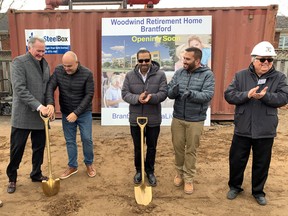 Mayor Kevin Davis, left, MP Larry Brock, Tej Bawa and Danny Bawa of Bawa Hospitality Management and architect Linas Saplys celebrated the ground-breaking for Woodwind Retirement Home on North Park Street Friday. Foundation construction is expected to begin immediately.