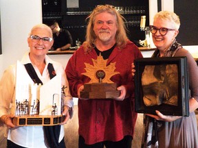 Local playwright Peter Paylor won three awards for the Brockville Theatre Guild's production of "Dear Ray" at the Eastern Ontario Drama League One-Act Play Festival held recently in Lindsay. From the left are: Lorraine Palmer-Smith is holding the Donald Endicott Award for Best Coordinated Production, Paylor is holding the Rural Route Theatre Award for Best Production of a New Canadian Play, and Lisa Leroux is holding the Belleville Theatre Guild Award for Best Actor in a Comedy. The play was also nominated for the Peterborough Examiner Award for Best Visual Production. Paylor had a second play at the festival – "The Black Chair" by Theatre Night in Merrickville. It didn't win any awards, but it was nominated in five categories. SUBMITTED PHOTO