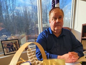 Mohawks of the Bay of Quinte Chief R. Donald Maracle inside his office in Tyendinaga Mohawk Territory with a basket of items created as part of the Building a Bundle program, a program created by youth for youth. (Jan Murphy/Local Journalism Initiative Reporter)