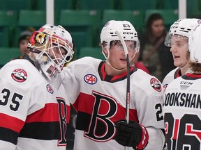 Members of the Belleville Senators congratulate goaltender Antoine Bibeau after his 49-save performance in a 4-1 win over the Laval Rocket at CAA Arena Saturday evening. © Jana Chytilova/Freestyle Photography