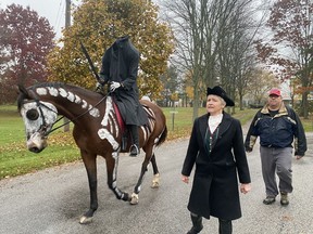 The Headless Horseman made his annual visit to Port Ryerse on Monday, keeping a Halloween tradition that started in 2007.  Charlotte Elliott, as the Horseman, was joined by her husband Adam Elliott and Lorraine Fletcher as Ichabod Crane. Fletcher used special non-toxic paint to create a skeleton effect on horse Freebird.