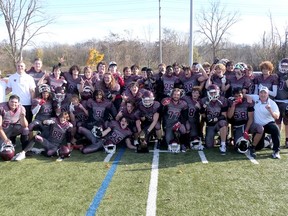 The Pauline Johnson Collegiate Thunderbirds celebrate with the Brant, Haldimand and Norfolk varsity football league championship trophy after defeating Simcoe Holy Trinity 29-19 Saturday afternoon. CHRIS ABBOTT