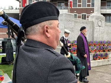 Piper Kieran McPate plays a lament during the Remembrance Day service Friday  in Paris. Susan Gamble