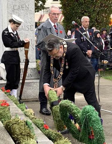 Brant County Mayor David Bailey places a wreath during Friday's Remembrance Day service in Paris. Susan Gamble