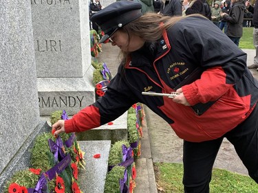 At the end of the Remembrance Day service in Paris, many in the crowd came forward to lay their poppies on the cenotaph. Susan Gamble