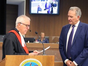 Justice David A. Broad performs the declaration of office with Kevin Davis, officially making him the mayor of Brantford for the next four years. The inaugural meeting of city council was held Tuesday night. Michelle Ruby