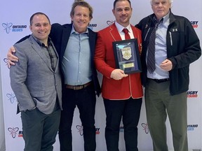 Brantford's Aaron Carpenter (red jacket) was recently inducted into the Rugby Ontario Hall of Fame. With Carpenter are his former Harlequins teammates, Dave Neill (left) and Marc Cohoon, and Bob Boos, former Brantford Collegiate Institute rugby coach. Submitted