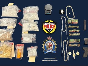 Police say they seized drugs, weapons and cash during raids on Thursday at two homes in Brantford. Submitted